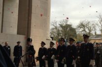The poppy petals fall during the Remembrance Ceremony at the Menin Gate – Armistice Remembrance Tour