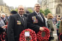 Tony Eden of Rifleman Tours with George Lowe waiting for the Poppy Parade to begin – Armistice in Ypres and Passchendaele 100 Anniversary Battlefield Tour